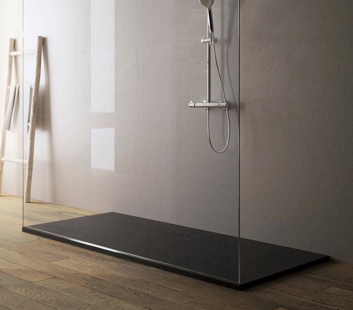 Modern bathroom with a shower area and wooden floor.